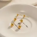 Arete cuentas colgantes 1.webp